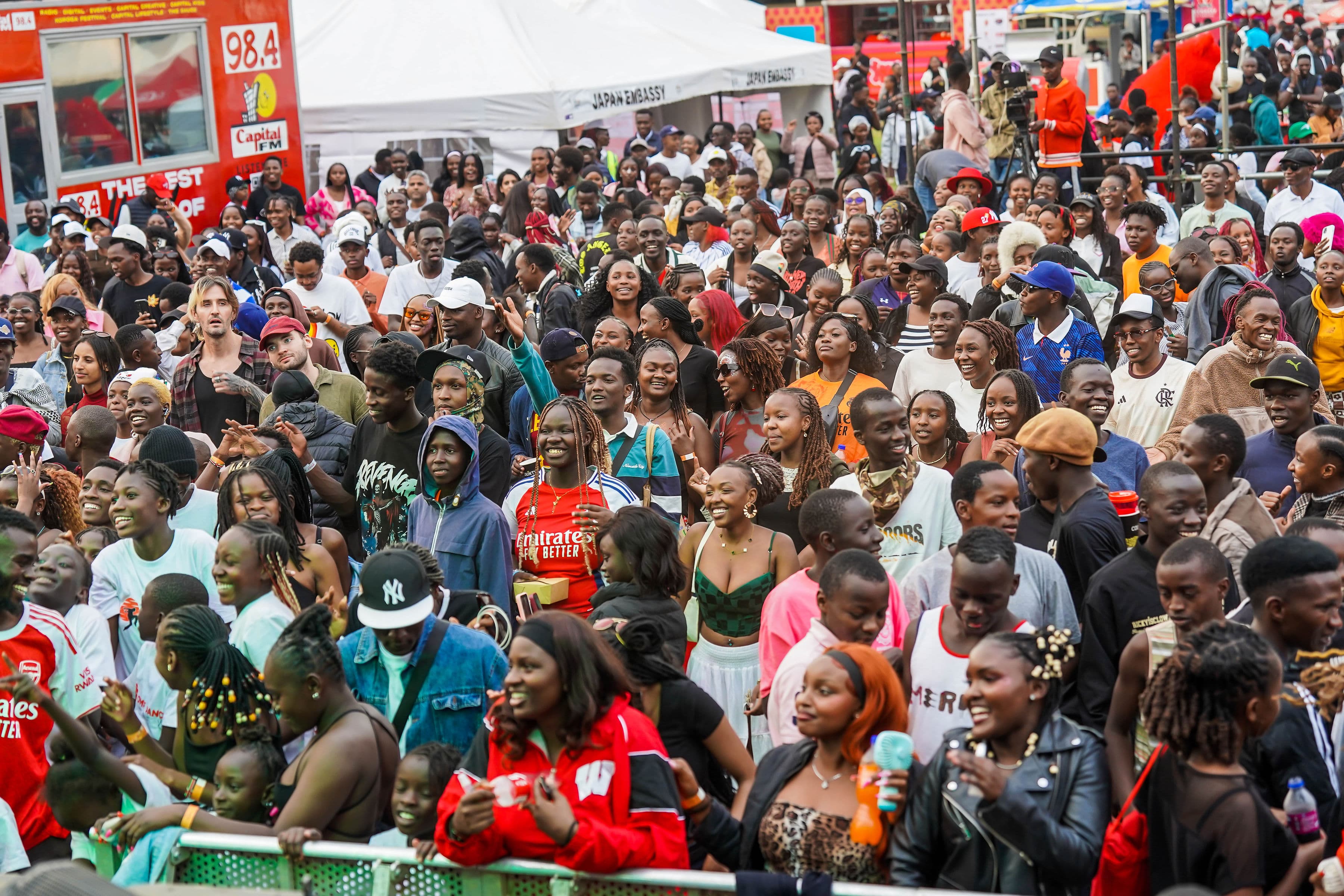 A wide view of a large festival crowd