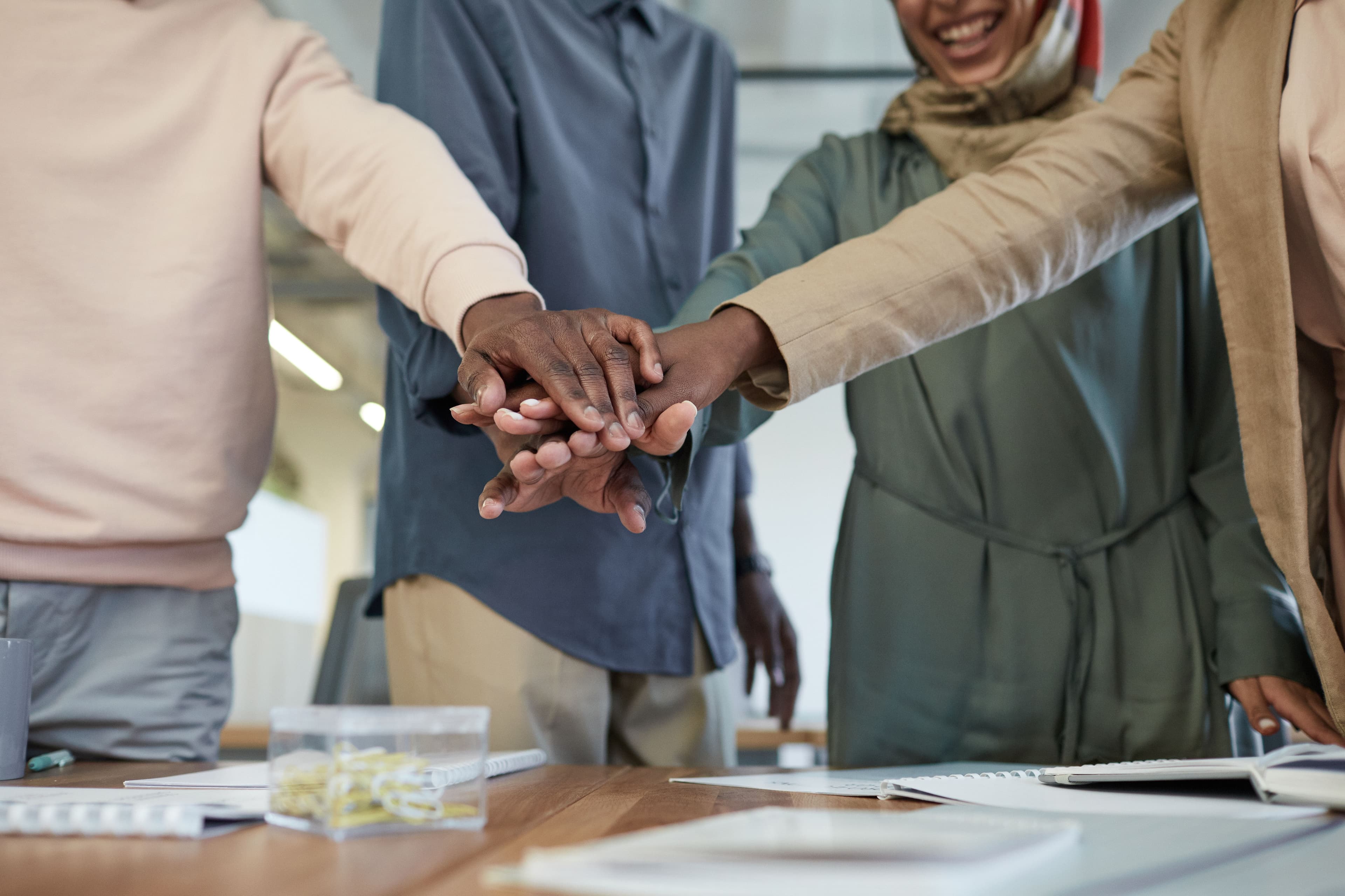 Hands joined together in community
